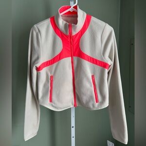 Free People bone colored fleece jacket with orange
Accents